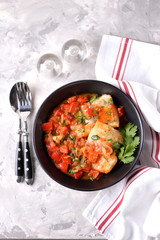 White sea fish stewed with onion, red pepper, tomatoes, garlic, coriander and cumin.