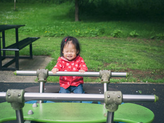 Fototapeta na wymiar baby girl playing in the playground