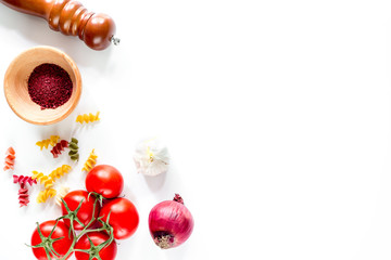 Preparing for cooking italian pasta white background top view copyspace