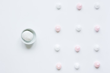 light breakfast with marsh-mallow and coffee on white table background top view