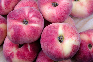 Close up view of a few fresh ripe saturn peach © Ket Sang Tai