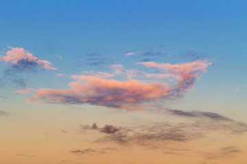 Orange clouds on blue sky in sunset time, cloudscape background