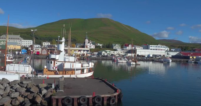 HUSAV&Iacute;K, ICELAND &ndash; SEPTEMBER 2016 : Aerial shot of Husav&iacute;k Bay on a beautiful day with boats and ships in view