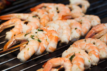 barbecue in the garden - summer- prawns and vegetables on skewers