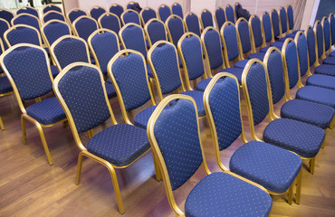 Fototapeta premium Empty conference chairs in row at a business room