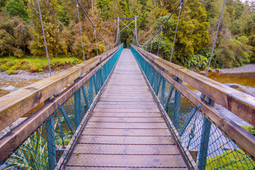 Fototapeta na wymiar Suspension bridge in southwest in National Park, located in New Zealand