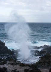 Fototapeta na wymiar Nakalele Blowhole on north coast of Maui erupts