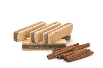 Wafers and cinnamon on a white background