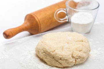 Fototapeta na wymiar Butter Cookies Preparation : Cookies dough and rolling pin