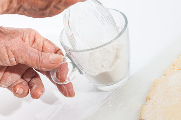 Butter Cookies Preparation : Adding flour to the glass edge to cut dough