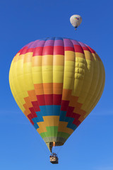 Fototapeta premium Balloon flying over California winery and vineyard during Hot Air Balloon Festival