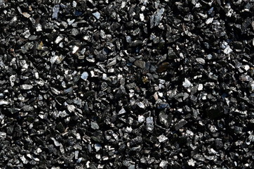 Background of fine shiny charcoal of anthracite coal close-up. - obrazy, fototapety, plakaty