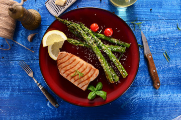 Grilled Tuna steak with roasted asparagus and parmesan