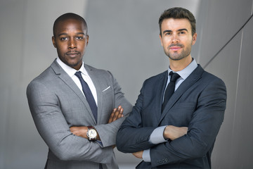 Business men of diverse ethnicity, successful future world leaders, standing strong and confident
