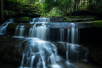 Fototapeta na wymiar Beautiful and Breathtaking waterfall, Located Phukradueng National park, Loei Province Thailand