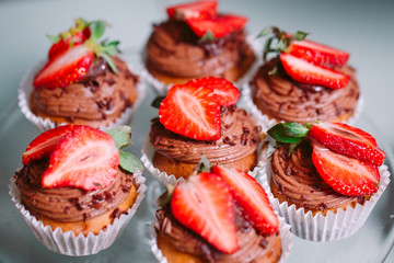 Homemade cupcakes with strawberries.