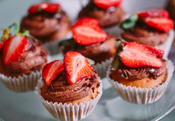 Homemade cupcakes with strawberries.
