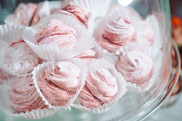 Trifles in plastic glasses.