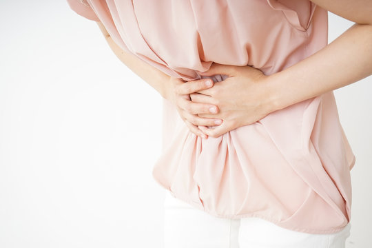 Young woman suffering from a stomachache