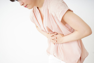 Young woman suffering from a stomachache