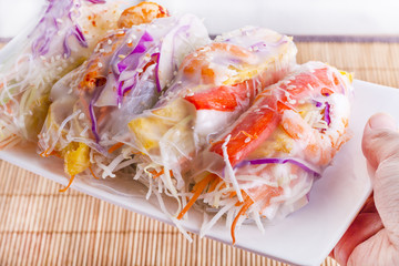 Vietnamese Spring Rolls, large variety of filled, rolled appetizers or dim sum found in East Asian and Southeast Asian cuisine