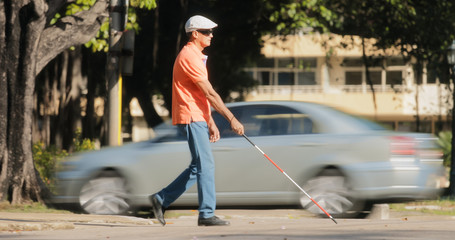 Blind Man Crossing The Road With Cars And Traffic