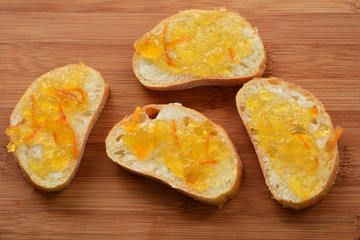 Small bread slices with orange marmalade