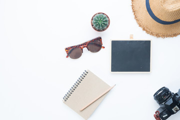 Flat lay style of summer accessories, Travel items on white background with blank board for text and copy space