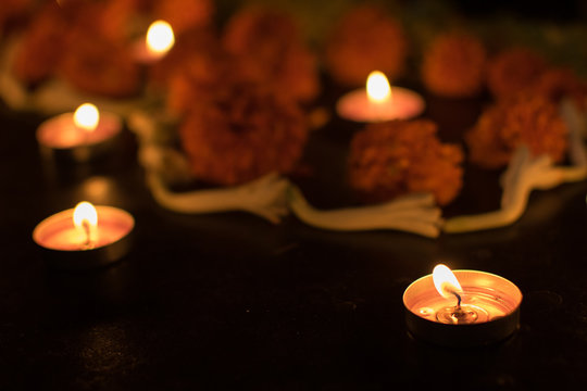 Deepabali - colourful candles are lit in darkness