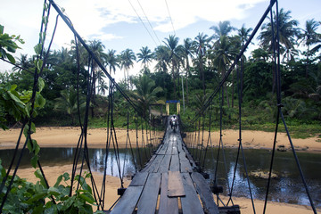 Crossing a hanging bridge with a motorcycle