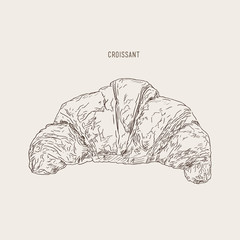 a hand drawn vector illustration of a Croissant.