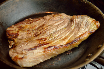 Cooked Red meat beef on a pan ready to be served