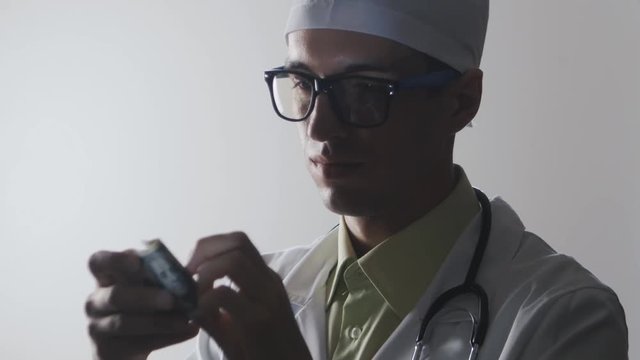 Doctor counts the money. A bribe to a medical worker. Expensive medicine.