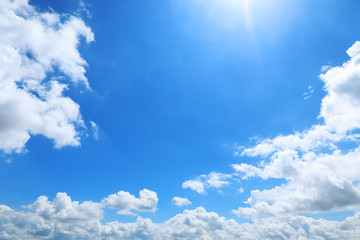beautiful white clouds and sunshine on blue sky for background and design