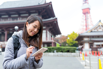 Woman use of cellphone in Tokyo