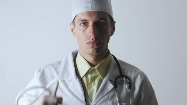The doctor offers a choice between a noose and a medicine. The choice between suicide or treatment.