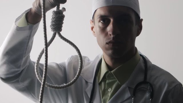 The doctor shows a noose. The medical worker advises suicide. The impotence of medicine. Doc makes a fatal diagnosis.