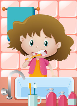 Girl brushing teeth at the sink