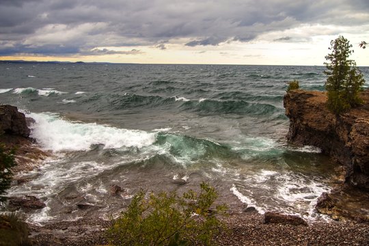 Lake Superior Coast. Waves crash into a cove on the rocky shores of Lake Superior in Presque Isle Park in Marquette, Michigan.