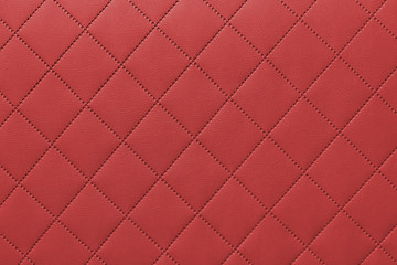 detail of red sewn leather, gray leather upholstery background pattern