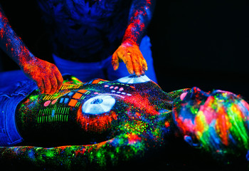 Concept. DJ playing on the deck. Girl painted as a DJ deck.