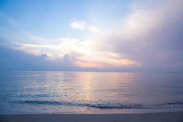 Beautiful sky, sunrise and waves at the beach