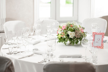 table setting, festive round tables ready for guests.