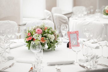 table setting, festive round tables ready for guests.
