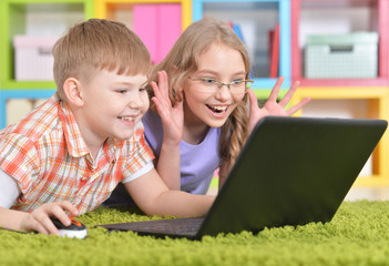 Fototapeta na wymiar teenagers in front of modern laptop