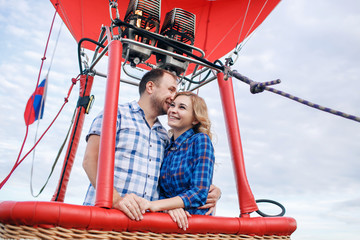 adventure. Beautiful romantic couple hugging in bascket hot air balloon © malkovkosta