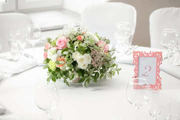 table setting, festive round tables ready for guests.