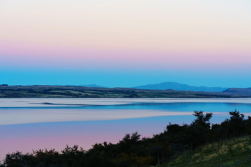 Beautiful sweet colour Pukaki lake in twilight at dusk , Mackenzie District, Canterbury , South Island of New Zealand