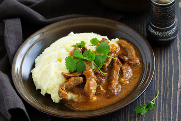 Meat sauce goulash with mashed potatoes.