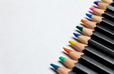 Colored pencils across  paper